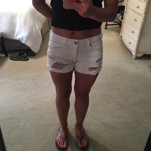 White distressed jean shorts